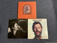 Front view of all three album covers