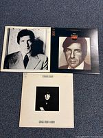 All three album covers laid out: Songs of Leonard Cohen, Songs From a Room, portrait-cover LP