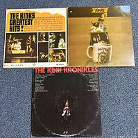 Front view of all three album jackets laid out on floor