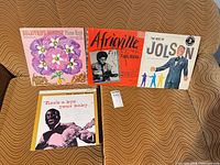 Group shot of all four LP album covers