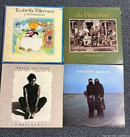 Group shot of all four album covers