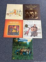 Group shot of four album covers laid out