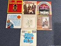 Group shot of six album jackets including the five listed items
