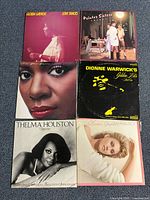 All six album covers laid out