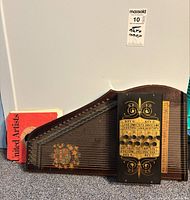 Autoharp front view with stack of 45s