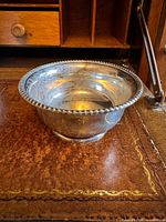 Side view of Birks sterling silver bowl showing rope rim and pedestal base