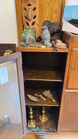 Overall view of cabinet with assorted decor