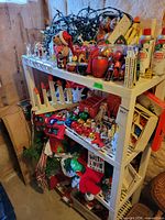 Shelf with assorted decorations and artificial tree