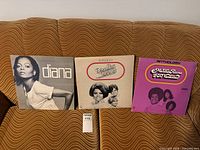 Front covers of all three vinyl albums displayed side by side