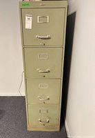 Front view of the four-drawer cabinet showing overall condition