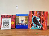 Group shot of all four art pieces standing on floor