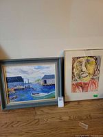 Both framed paintings side by side