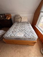 Full view of platform bed with mattress in room