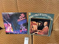 Both LP records front covers side by side