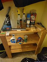 Full view of pine utility shelf with cleaning products
