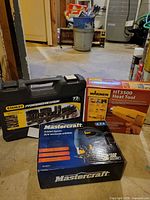 Overall lot showing Stanley socket set case, Wagner HT3500 heat gun box, Mastercraft jigsaw box