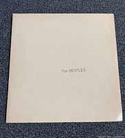 Front of white sleeve with embossed title