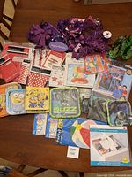 Overview of assorted party supplies spread on table