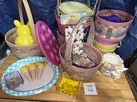 Group view of baskets, bunny container, silicone mold, platter with cones, tin, chicks, ceramic planter