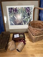 Overall lot showing framed print, tall basket, long tray basket, two small cylindrical baskets, wooden box