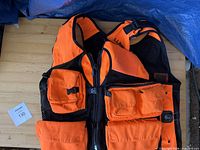 Front view of blaze orange hunting vest