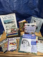 Front view showing main titles including The Art of Drawing People, Rodale’s Herbs, Eyewitness Whales, Grandma Moses and others