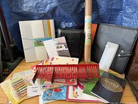 overall view showing binders, planners, cork roll, stationery items