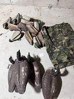 Group shot of duck and goose decoys with bag