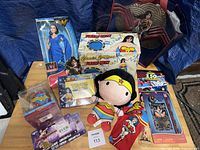 All Wonder Woman themed items arranged on table, showing variety