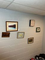Overall wall view showing arrangement of six framed items