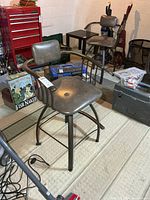 Front-angle view of one swivel chair showing frame, seat, backrest and arms