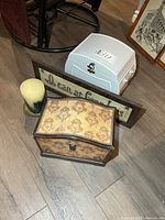 Group shot of both boxes, wooden sign and pillar candle