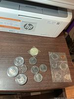 Overview of all coins and 1980 mint set on tabletop