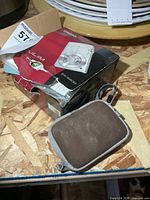 Casio EX-S200 box, Nikon camera pouch visible