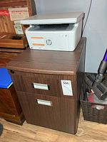 File cabinet with HP LaserJet printer on top