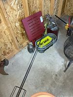 Overall lot showing metal pole, red folding table, planters, watering can