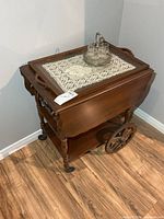 Full view of Gibbard walnut tea wagon with bar set on top