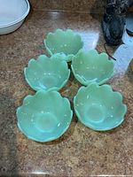 Five jadeite bowls top view