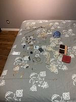 Entire lot spread on bed showing quantity and variety