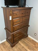 Front view of Kroehler tall dresser showing drawer configuration and hardware