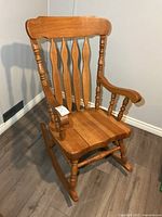 Front view of oak rocking chair