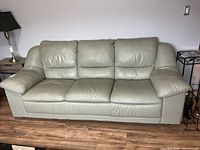 Front view of three-seat leather sofa