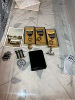 Full lot showing medals, badges, wallet, button, ribbon bar and photo