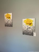 Both canvas prints hanging on wall