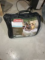 Carry bag exterior showing Coleman branding and product label