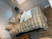 Top view of bed showing duvet and pillows