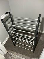 Full view of shoe rack angled, showing dimensions and tier structure