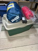 Entire lot showing sleeping bags, poles and tote