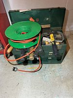 Toolbox with cord reel and tools overview