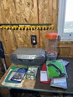 Bench with Sony boombox and assorted packaged hardware items